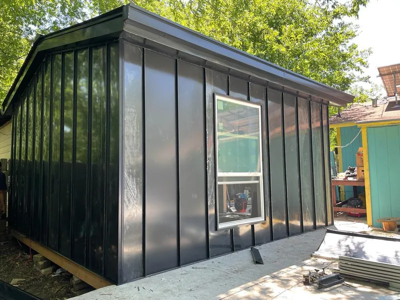 Black standing seam metal wall panels for Roof Inspection in Florida Gulf Coast University