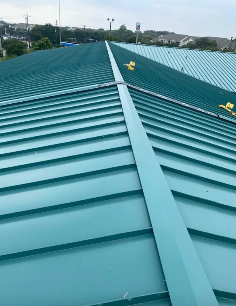Green commercial metal roof ridge and valley for Metal Roof Repair in Florida Gulf Coast University